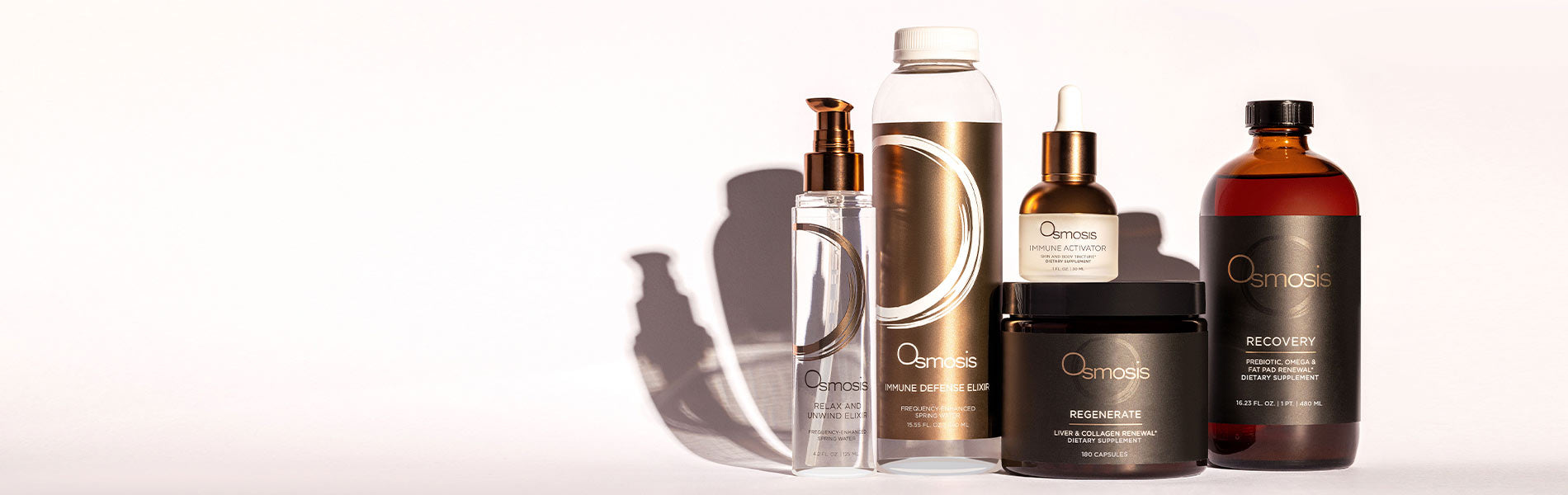 Collection of Osmosis wellness products on an off-white background