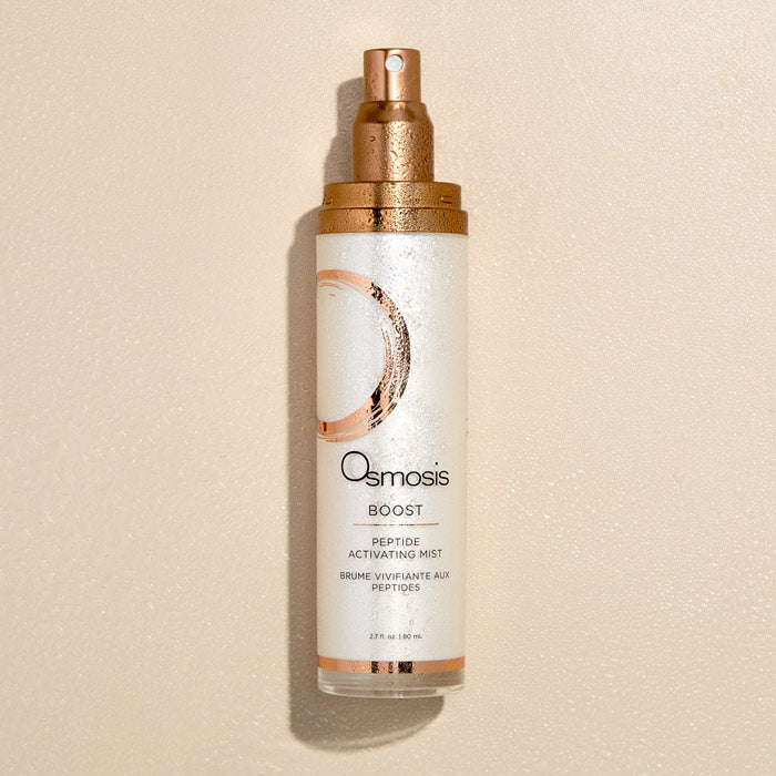 Osmosis Boost Peptide Activating Mist bottle on a beige background