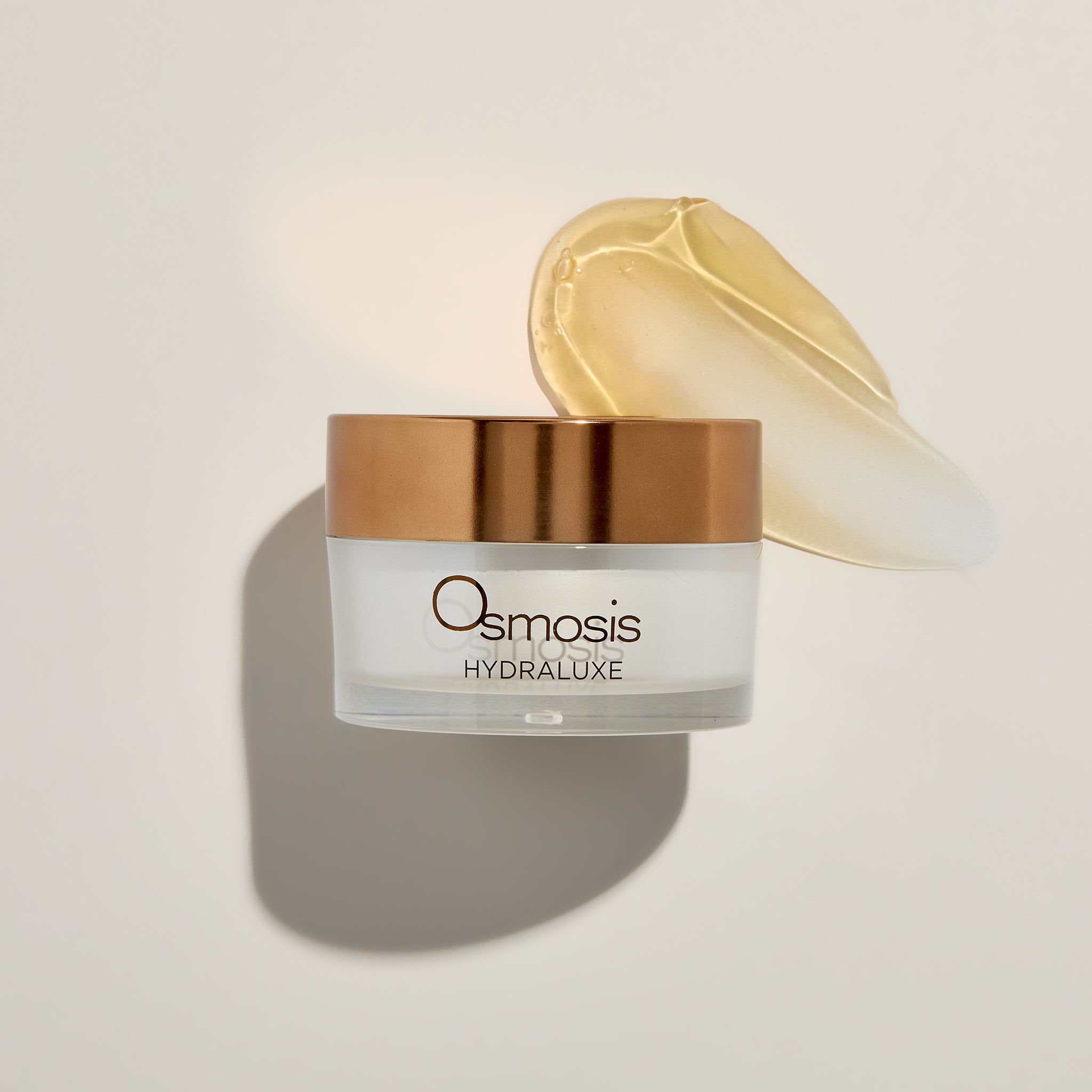 Osmosis Hydraluxe Mask with product swatch on a beige background