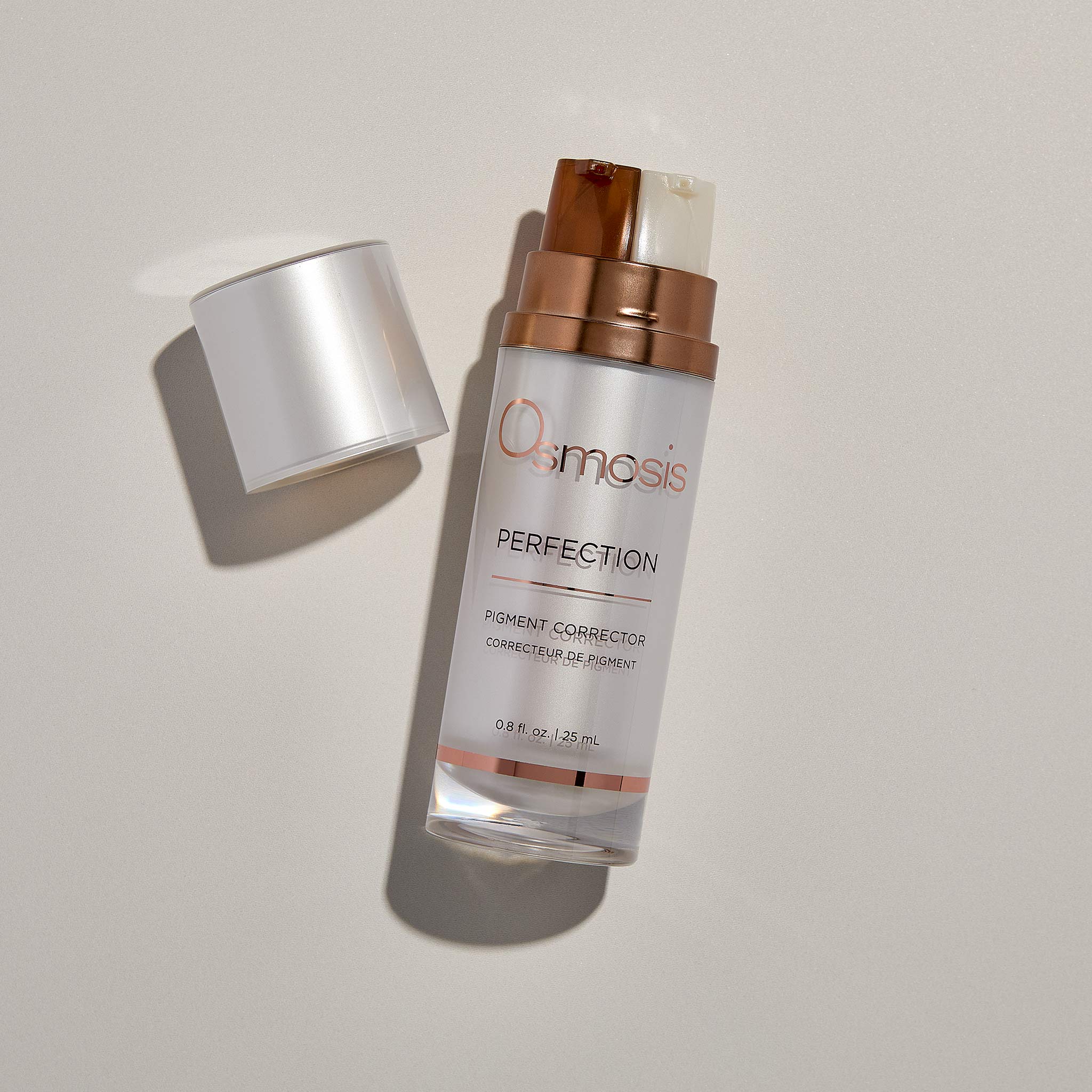 Osmosis Perfection Pigment Corrector with the cap off on a tan background