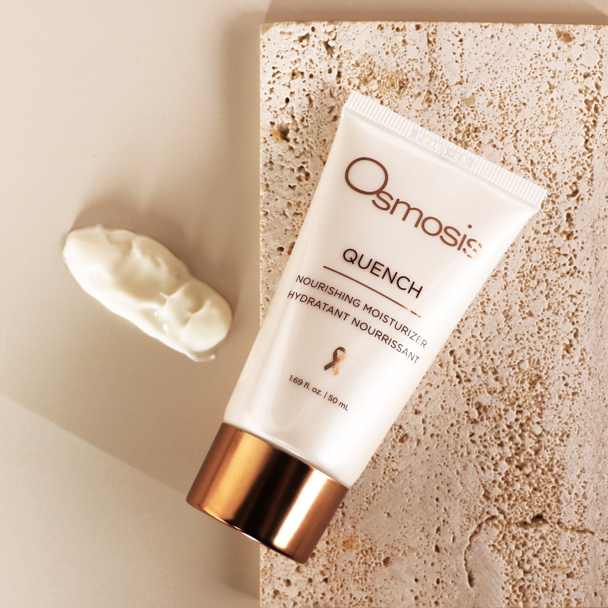 Osmosis Quench Moisturizer with product swatch on a stone and tan background