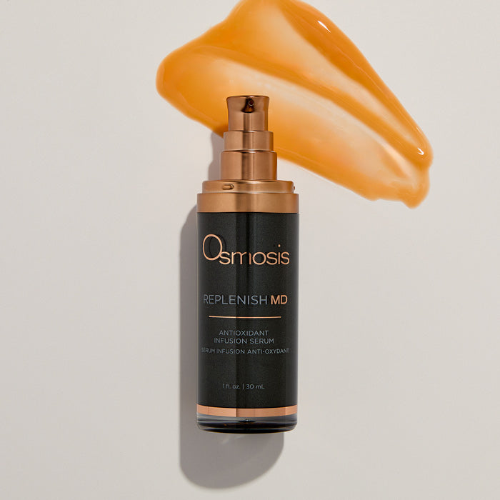 Osmosis Replenish MD serum bottle with a swatch of serum on a beige background