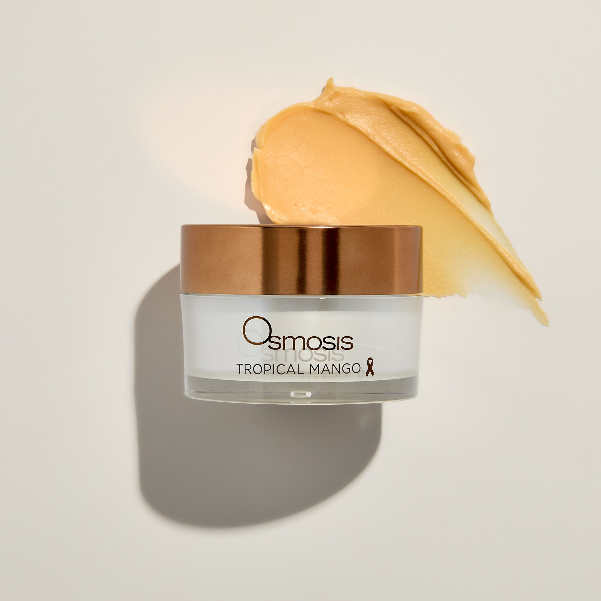 Osmosis Tropical Mango Mask with product swatch on a beige background