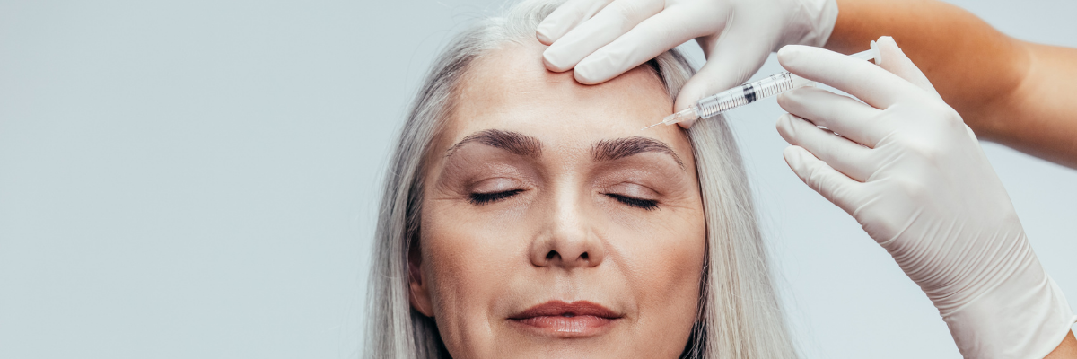 Older Women getting a injection in face