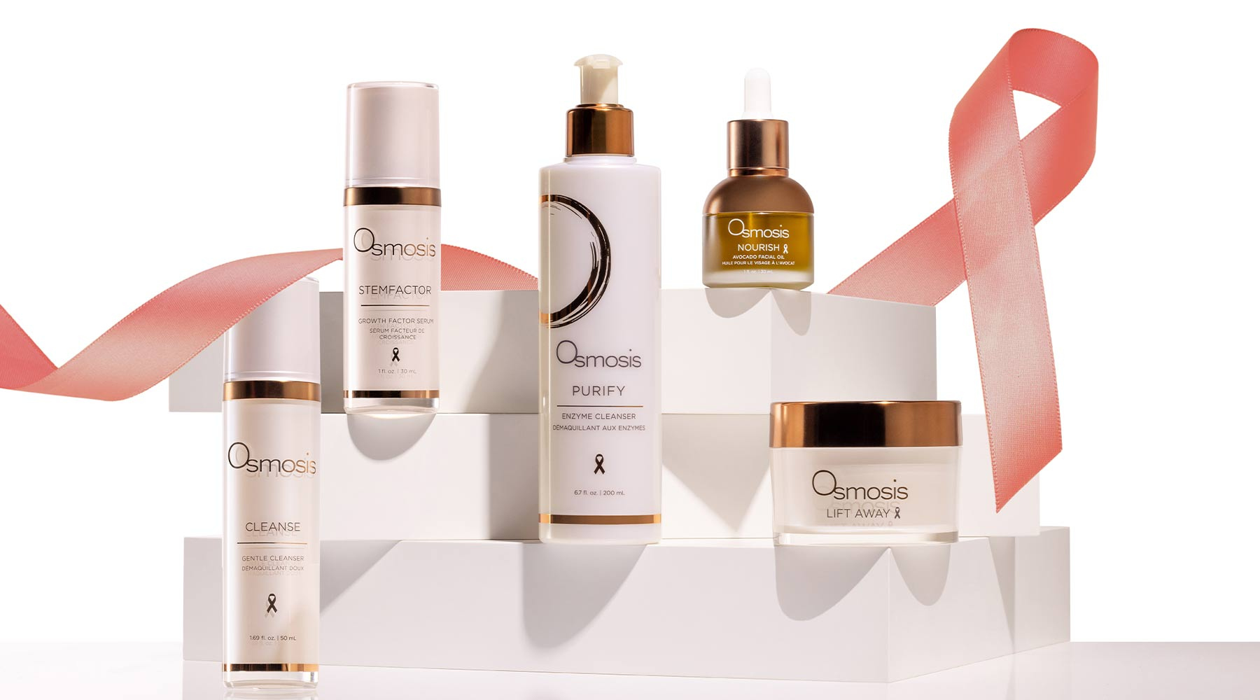 Osmosis skincare products with a pink ribbon on a white background | Osmosis Beauty