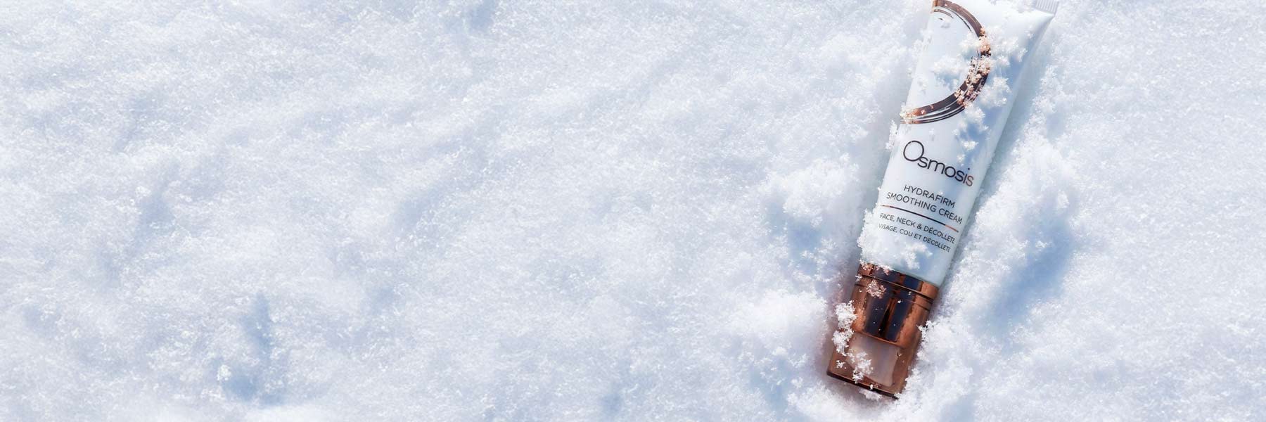 Osmosis Hydrafirm Smoothing Cream in the snow.