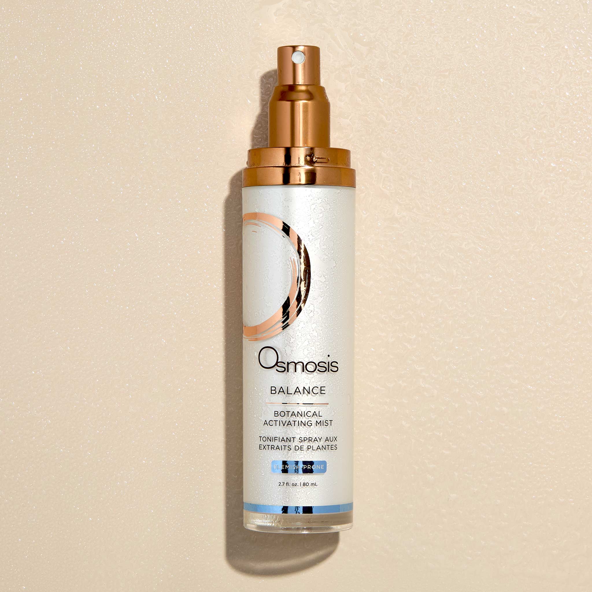 Osmosis Balance Activating Mist with spray on bottle on a beige background