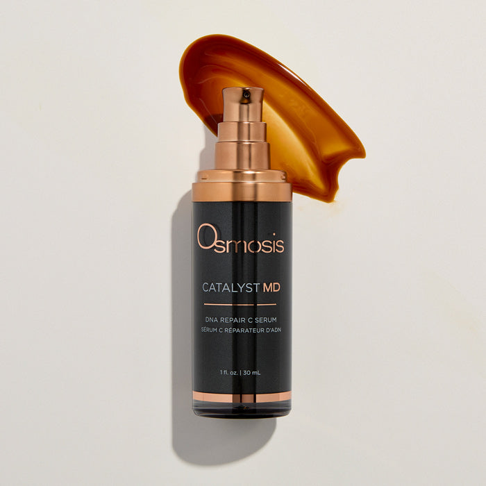 Osmosis Catalyst MD serum bottle with a swatch of brown color on a light background