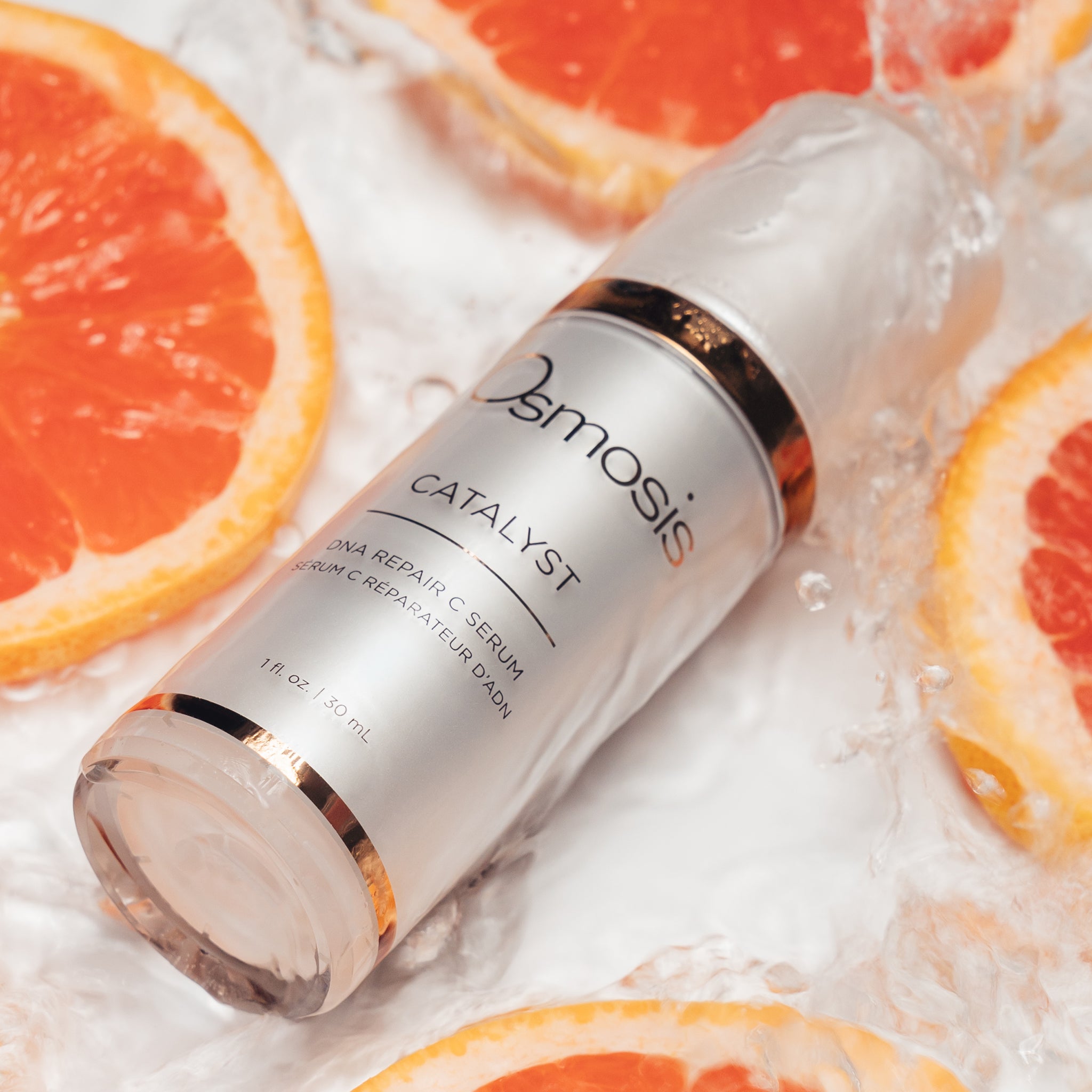 Osmosis Catalyst Serum in grapefruit slices and water
