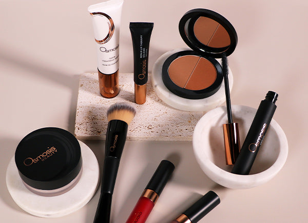 Collection of Osmosis Color Cosmetic products on an off-white backround