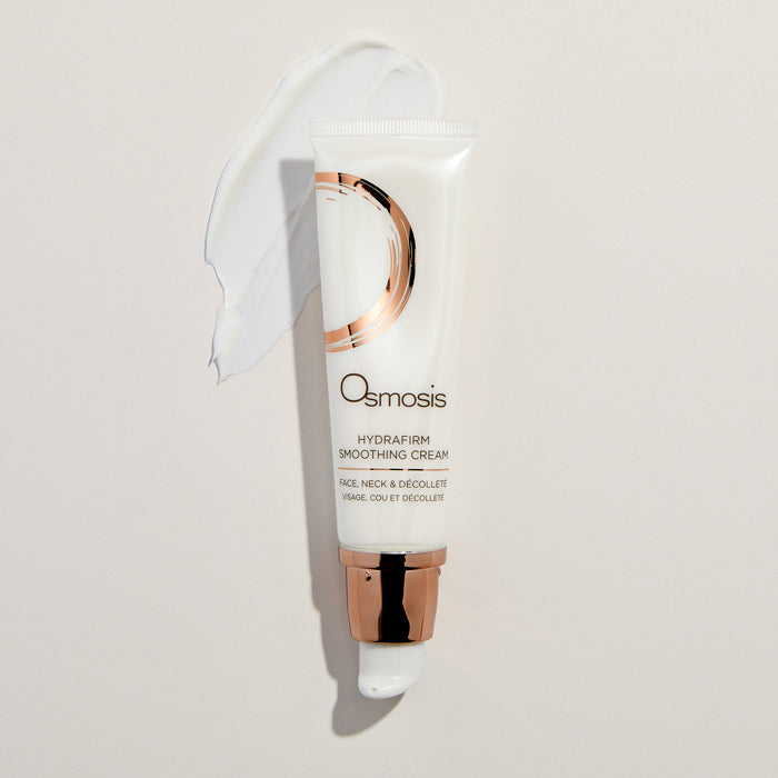 Osmosis Hydrafirm smoothing cream tube on a light beige background