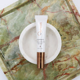 Osmosis Illuminate Eye and Lip Treatment on a bowl.