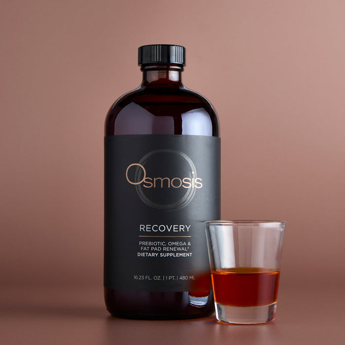 Osmosis Recovery Supplement with glass on copper background