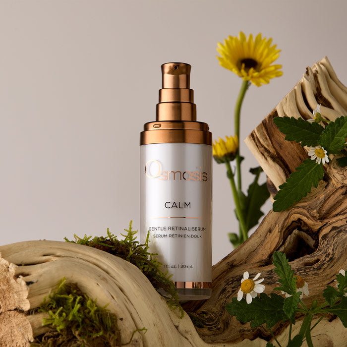 Calm bottle on wood with flowers