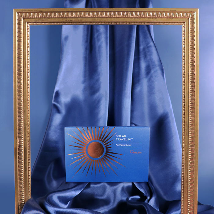 Blue box with sun design on a blue fabric background