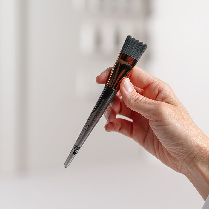 Stimulating Scallop Brush in hand