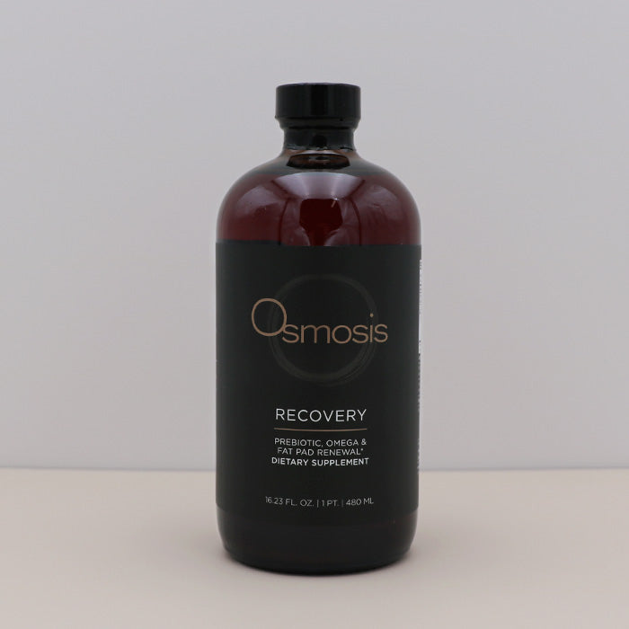 Bottle of Osmosis Recovery supplement on a light gray background