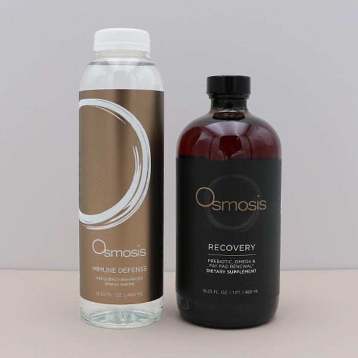 Two Osmosis products, one clear bottle and one dark bottle with a black cap, on a light surface.