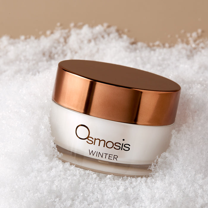 Osmosis Winter Enzyme Warming Mask in snow on a tan background