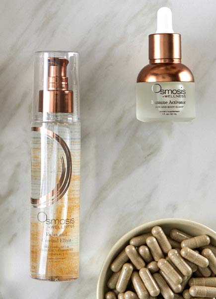 Osmosis Relax and Unwind Elixir next to a bowl of supplements